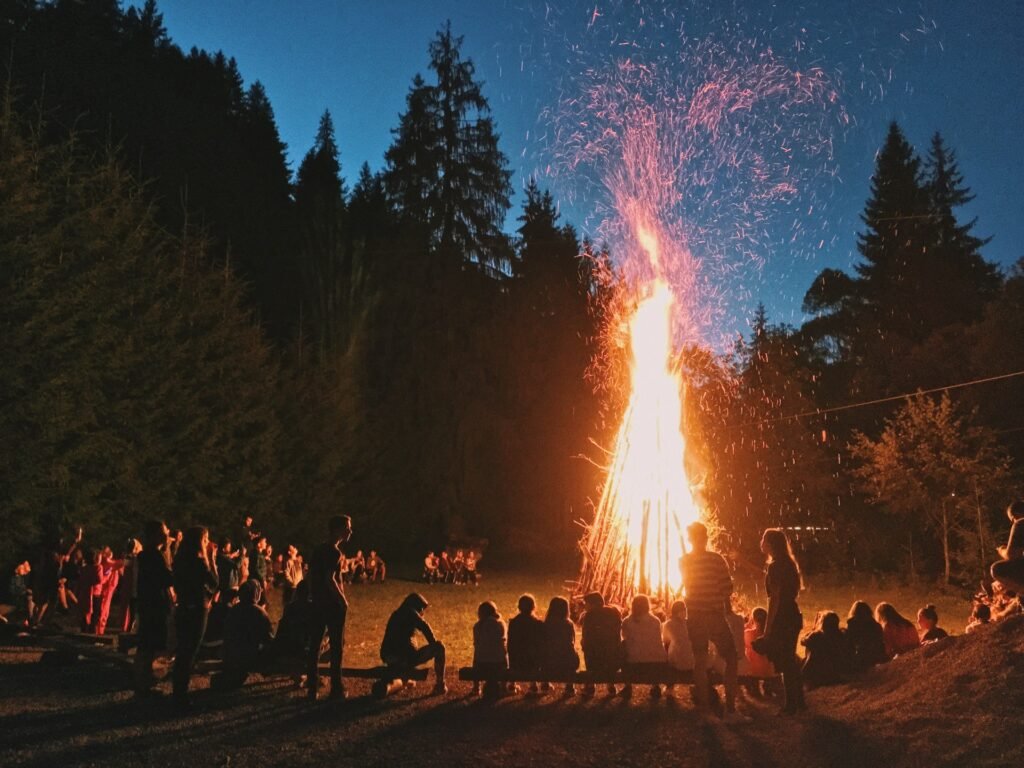 Bonfire Night celebration with fireworks, bonfires, and crowds enjoying the tradition.